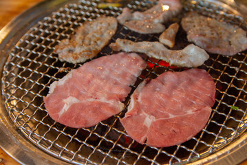 Raw beef on grille for barbecue Japanese style or yakiniku