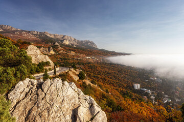 Scenic road in the mountains in autumn. Very beautiful colorful autumn landscape with mountain serpentine. Crimea, Simeiz, Yalta.