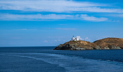 Fototapeta na wymiar Greece, Kea Tzia island. Seascape with lighthouse, clear blue sky