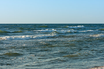 late evening at the Baltic Sea, the sun reflects on the waves