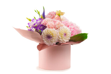 Pink and purple bouquet of flowers in a pink box isolated on white.