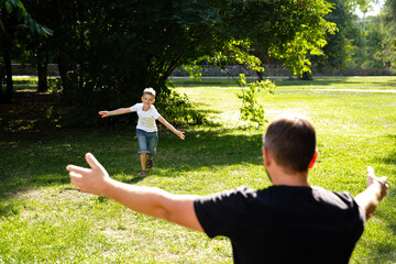 Little child boy runs towards daddy's arms. Family happiness. Long-awaited meeting. fathers and son...