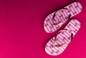 
Pink flip flops on bright pink background.Copy space.