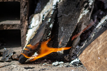 The birch coals burn with a bright flame