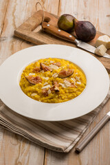 milanese risotto with cheese fig and sliced almond