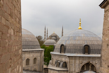 Obraz premium Domes of Saint Sophie Cathedral and Blue Mosque, from Saint Sophie, Istanbul, Turkey.