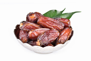 Palm dates on the silver plate, white background.
