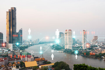 Obraz premium Social media icons hologram over panorama city view of Bangkok, Asia. The concept of people networking and connections. Double exposure.