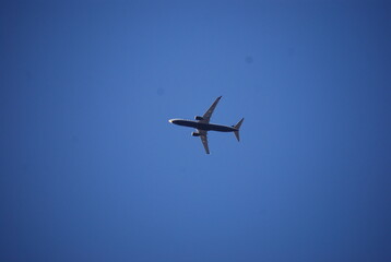 Fototapeta na wymiar Plane in Blue Sky Landscape