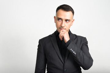 Portrait of handsome businessman in suit against white background