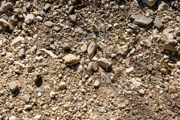 Background image of a stone crumb with small and large stones