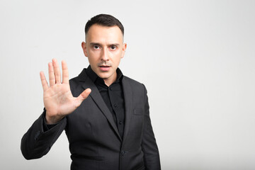 Portrait of handsome businessman in suit against white background