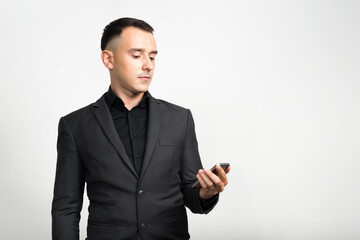 Portrait of handsome businessman in suit against white background