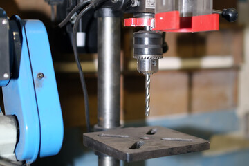 Drilling machine with a drill inserted. Metal drilling