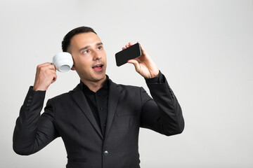 Naklejka premium Portrait of handsome businessman in suit against white background