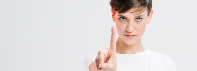 Portrait Of A Serious Young Woman Showing Stop Gesture