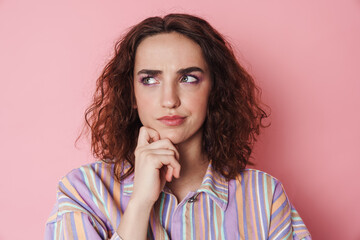 Fototapeta premium Image of redhead brooding woman thinking and looking aside