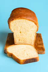 Sandwich bread sliced on wooden board. Hokkaido milk sandwich loaf
