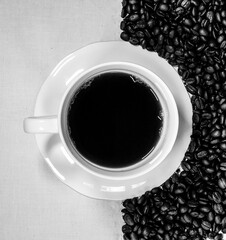 Coffee contrast beans and white cup and saucer