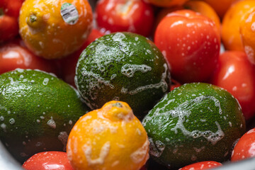 Washing fruits and vegetables with soap in home.