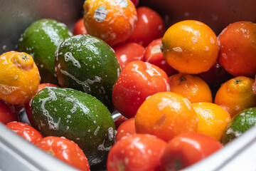 Washing fruits and vegetables with soap in home.