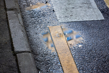 high-rise buildings reflections of sky and clouds and pre-storm sky in summer