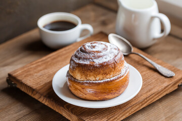 Homemade sweet buns with powdered sugar. Sweet breakfast.