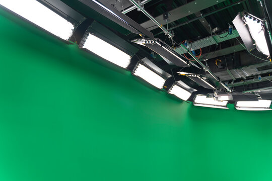 Professional Broadcast studio light equipment in virtual green studio room. LED Light technology