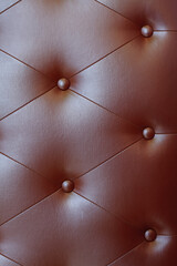 Red leather texture decorate background, coach coupler on black leather, selective focus
