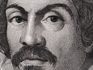 Caravaggio portrait on 100000 italian lire banknote closeup macro. One of the greatest and innovative painter of the Renaissance.