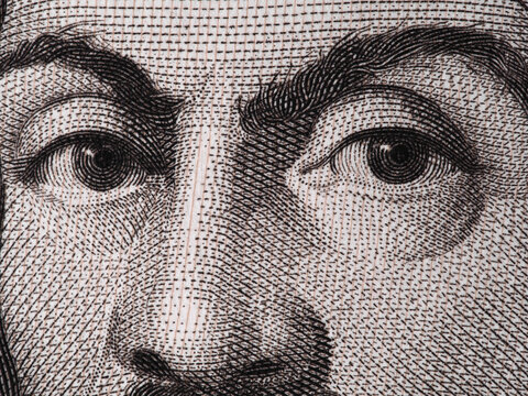 Caravaggio face on 100000 italian lire banknote extreme macro.