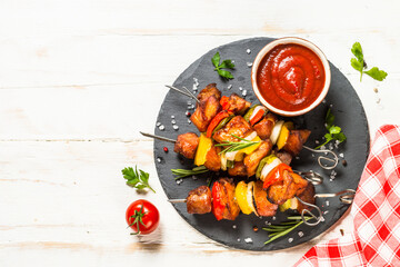 Shish kebab at skewers with vegetable.