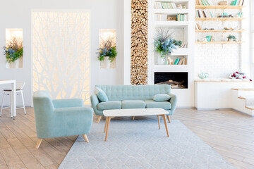 Fashionable spacious apartment with a stylish design in green, grey and white pastel colors with big window and decorative walls. bedroom and kitchen space