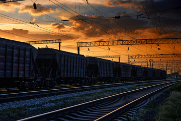 railway and cars in a beautiful sunset, dramatic sky and sunlight