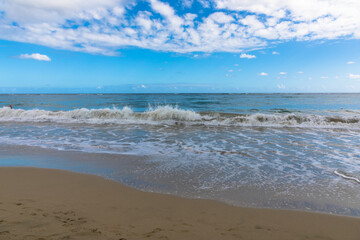 Fototapeta na wymiar Water rolling on a golden sand beach, Dominican Republic, Caribbean