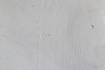 White dusty surface with bumps and scratches.