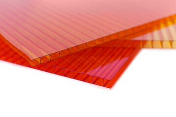Orange, yellow and red color Polycarbonate Sheet. Acrylic Plastic glass isolated on white background
