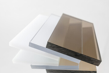 Solid Polycarbonate Sheet. Brown, white, transparent. Acrylic Plastic glass