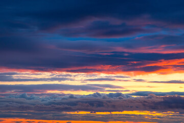 Unrealistic colorful sunset in the lush clouds in Iceland