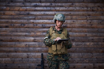 woman soldier using tablet computer