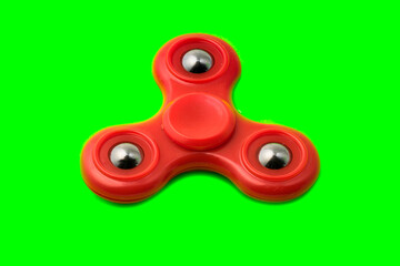 Red spinner isolated on green background
