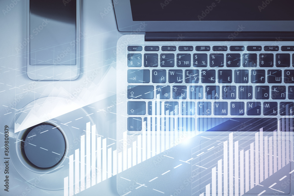 Wall mural stock market chart and top view computer on the table background. multi exposure. concept of financi