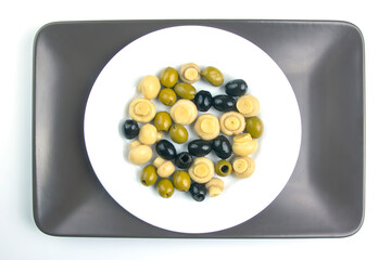 salad of black and green olives on a plate. food and vegetables. diet and weight loss