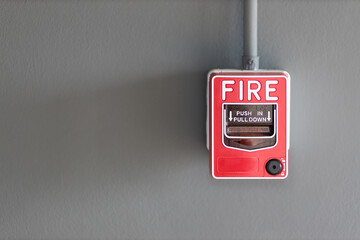 fire alarm box on cement wall for warning and security system in the condominium place. standard...