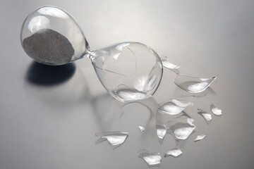 broken hourglass. waste of time. end of opportunity. stop measuring hours. shards of glass....