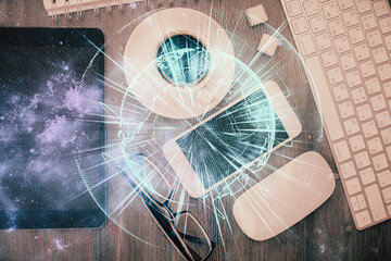 Double exposure of business theme hologram over desktop with phone. Top view. Mobile international trade connection concept.