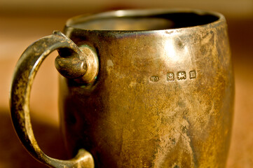 old silver mug with British hallmarks