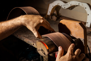 Luthier making an acoustic guitar