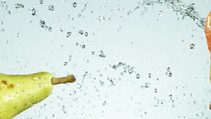 Super slow motion of pears hitting in the air with water splashes. Filmed on high speed cinema camera, 1000 fps. - Powered by Adobe