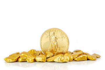 golden american eagle one ounce coin laying on a heap of golden nuggets, golden ore